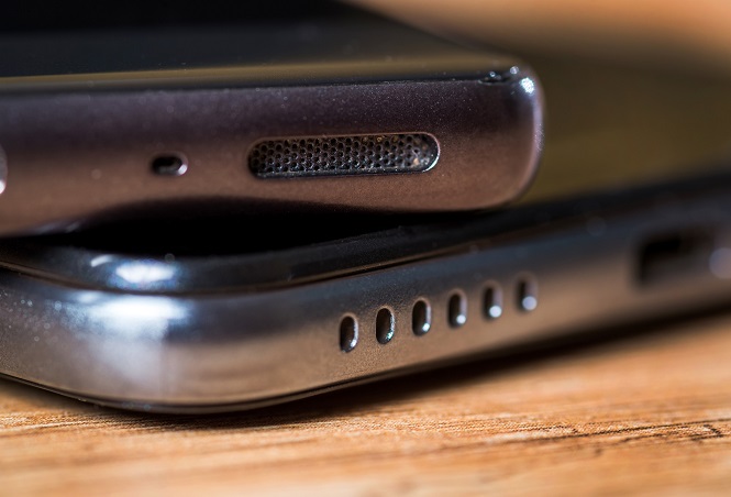 Mobile phone speakers on the wooden table